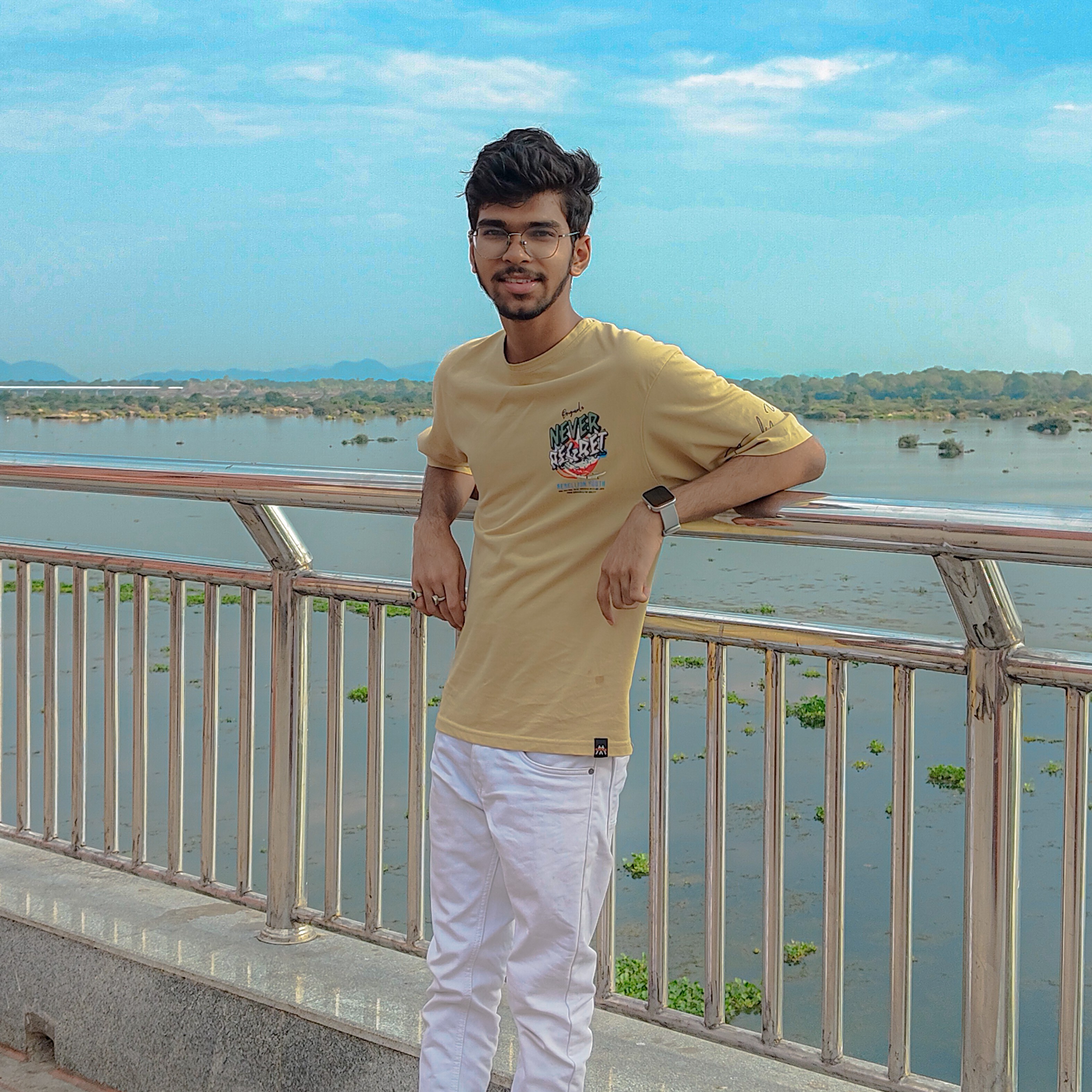 Portrait of Nirakar Patel, a professional developer in a modern workspace with creative digital elements floating around